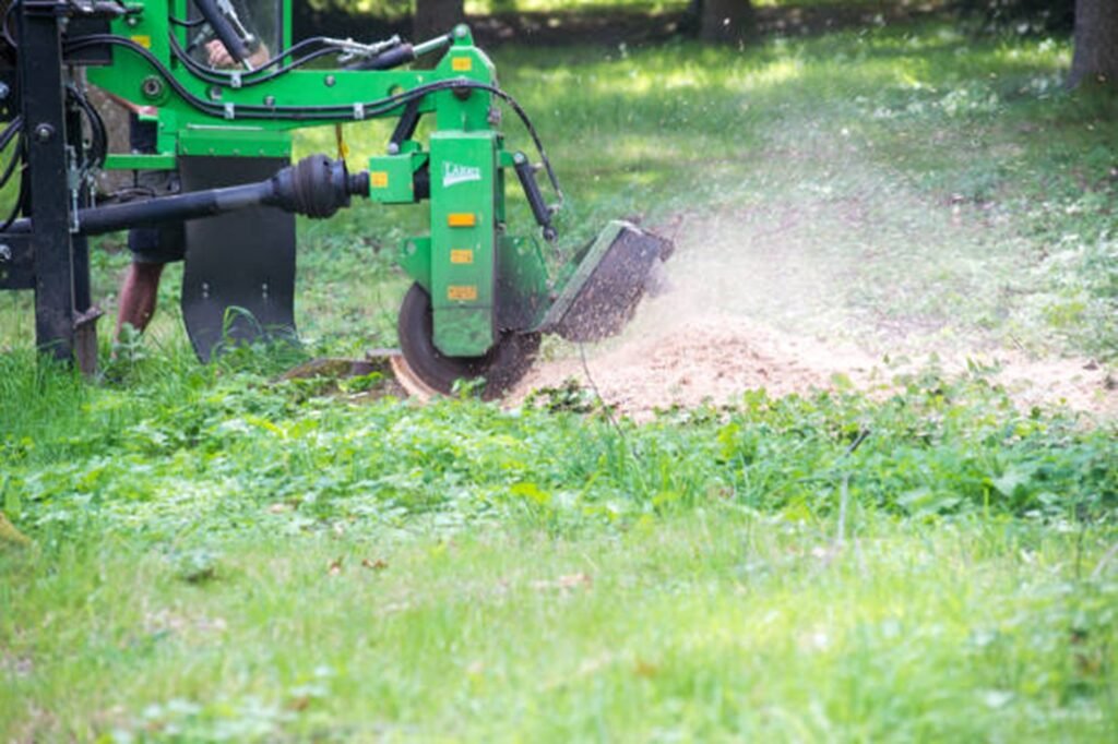 Stump grinding equipment removing a tree stump from a residential yard in Willowick, OH